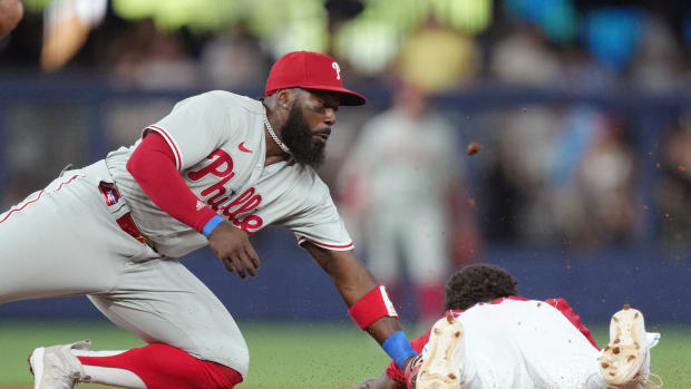 Jul 8, 2023; Miami, Florida, USA; Philadelphia Phillies second baseman Josh Harrison (2) tags out Miami Marlins center fielder Dane Myers (54) at second base in the first inning at loanDepot Park. Mandatory Credit: Jim Rassol-USA TODAY Sports  